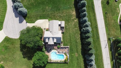 Wake up to sweeping fairway views and end your day poolside at on Briar Leaf Golf Club in Indiana - for sale on GolfHomes.com, golf home, golf lot