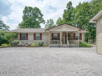 Lakefront Home with Detached Garage and Covered Boat Dock.  Step on Lake Tansi Village Country Club in Tennessee - for sale on GolfHomes.com, golf home, golf lot