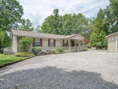 Lakefront Home with Detached Garage and Covered Boat Dock.  Step on Lake Tansi Village Country Club in Tennessee - for sale on GolfHomes.com, golf home, golf lot