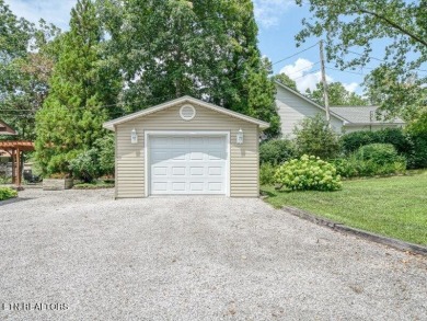 Lakefront Home with Detached Garage and Covered Boat Dock.  Step on Lake Tansi Village Country Club in Tennessee - for sale on GolfHomes.com, golf home, golf lot