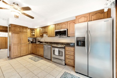 Wake up to sweeping fairway views and end your day poolside at on Briar Leaf Golf Club in Indiana - for sale on GolfHomes.com, golf home, golf lot