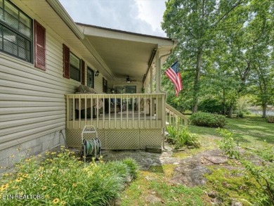 Lakefront Home with Detached Garage and Covered Boat Dock.  Step on Lake Tansi Village Country Club in Tennessee - for sale on GolfHomes.com, golf home, golf lot