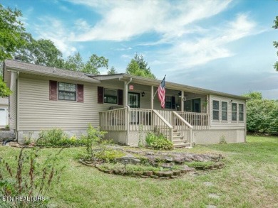 Lakefront Home with Detached Garage and Covered Boat Dock.  Step on Lake Tansi Village Country Club in Tennessee - for sale on GolfHomes.com, golf home, golf lot