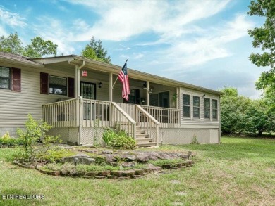 Lakefront Home with Detached Garage and Covered Boat Dock.  Step on Lake Tansi Village Country Club in Tennessee - for sale on GolfHomes.com, golf home, golf lot