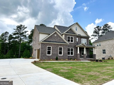 The Jasmine Plan built by Heatherland Homes. Behind the on Canongate At Heron Bay in Georgia - for sale on GolfHomes.com, golf home, golf lot