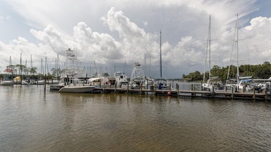 Charming Patio Home in Bluewater Bay - 1000 Bay Drive, Unit 525 on Fairway Oaks at Magnolia Golf Course in Florida - for sale on GolfHomes.com, golf home, golf lot