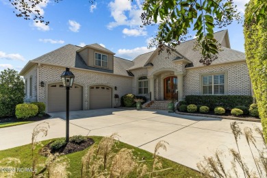 This home boasts captivating sunset views over the 3rd hole of on Cape Fear National At Brunswick Forest in North Carolina - for sale on GolfHomes.com, golf home, golf lot