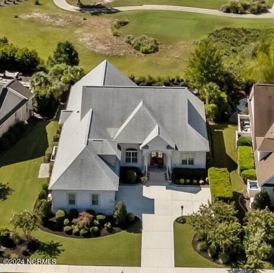 This home boasts captivating sunset views over the 3rd hole of on Cape Fear National At Brunswick Forest in North Carolina - for sale on GolfHomes.com, golf home, golf lot