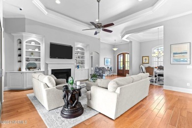 This home boasts captivating sunset views over the 3rd hole of on Cape Fear National At Brunswick Forest in North Carolina - for sale on GolfHomes.com, golf home, golf lot