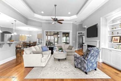 This home boasts captivating sunset views over the 3rd hole of on Cape Fear National At Brunswick Forest in North Carolina - for sale on GolfHomes.com, golf home, golf lot