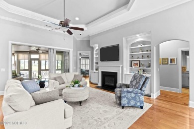 This home boasts captivating sunset views over the 3rd hole of on Cape Fear National At Brunswick Forest in North Carolina - for sale on GolfHomes.com, golf home, golf lot