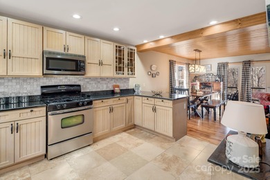 Enjoy a direct view of Big Bald Mountain from this spotless on Wolf Laurel Country Club in North Carolina - for sale on GolfHomes.com, golf home, golf lot