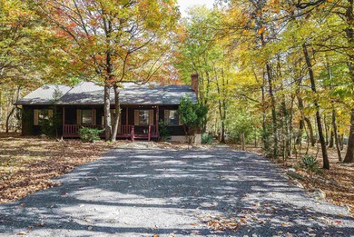Tucked away in the woods of Massanutten, this beautiful home on Woodstone Meadows Golf Course At Massanutten in Virginia - for sale on GolfHomes.com, golf home, golf lot