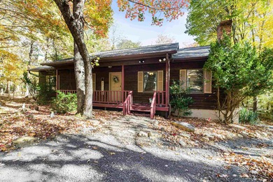 Tucked away in the woods of Massanutten, this beautiful home on Woodstone Meadows Golf Course At Massanutten in Virginia - for sale on GolfHomes.com, golf home, golf lot