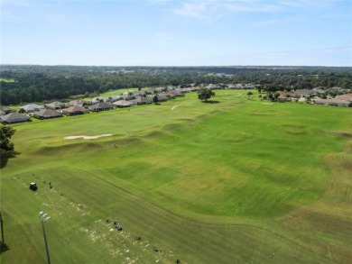 As you step into this luxurious golf course home overlooking the on Huntington Hills Golf and Country Club in Florida - for sale on GolfHomes.com, golf home, golf lot