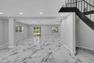 Discover this beautifully renovated 4-bedroom, 3-bath,  dream on Temple Terrace Golf and Country Club in Florida - for sale on GolfHomes.com, golf home, golf lot
