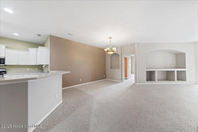 Live the good life in this upscale lakefront villa in Viera on Viera East Golf Club in Florida - for sale on GolfHomes.com, golf home, golf lot