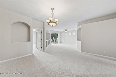 Live the good life in this upscale lakefront villa in Viera on Viera East Golf Club in Florida - for sale on GolfHomes.com, golf home, golf lot