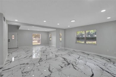 Discover this beautifully renovated 4-bedroom, 3-bath,  dream on Temple Terrace Golf and Country Club in Florida - for sale on GolfHomes.com, golf home, golf lot