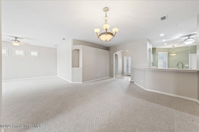 Live the good life in this upscale lakefront villa in Viera on Viera East Golf Club in Florida - for sale on GolfHomes.com, golf home, golf lot