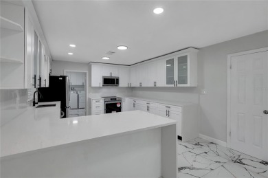 Discover this beautifully renovated 4-bedroom, 3-bath,  dream on Temple Terrace Golf and Country Club in Florida - for sale on GolfHomes.com, golf home, golf lot