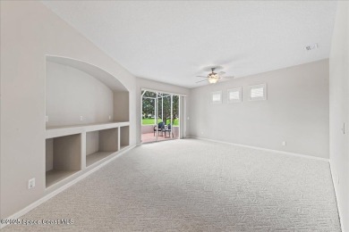 Live the good life in this upscale lakefront villa in Viera on Viera East Golf Club in Florida - for sale on GolfHomes.com, golf home, golf lot