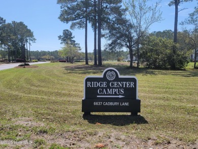 Beautiful naturally treed home site backing up to Leopard's on Ocean Ridge Plantation in North Carolina - for sale on GolfHomes.com, golf home, golf lot