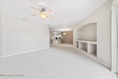 Live the good life in this upscale lakefront villa in Viera on Viera East Golf Club in Florida - for sale on GolfHomes.com, golf home, golf lot