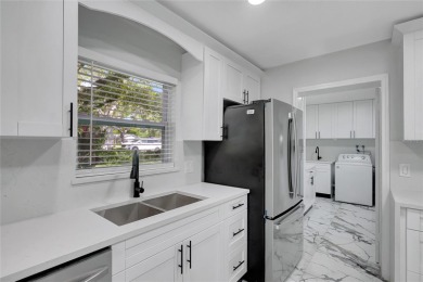 Discover this beautifully renovated 4-bedroom, 3-bath,  dream on Temple Terrace Golf and Country Club in Florida - for sale on GolfHomes.com, golf home, golf lot