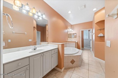 Live the good life in this upscale lakefront villa in Viera on Viera East Golf Club in Florida - for sale on GolfHomes.com, golf home, golf lot