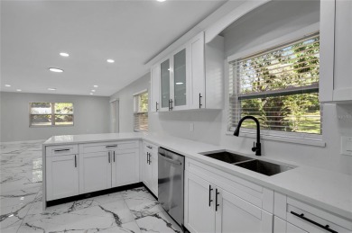 Discover this beautifully renovated 4-bedroom, 3-bath,  dream on Temple Terrace Golf and Country Club in Florida - for sale on GolfHomes.com, golf home, golf lot