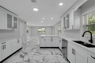 Discover this beautifully renovated 4-bedroom, 3-bath,  dream on Temple Terrace Golf and Country Club in Florida - for sale on GolfHomes.com, golf home, golf lot