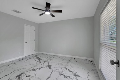 Discover this beautifully renovated 4-bedroom, 3-bath,  dream on Temple Terrace Golf and Country Club in Florida - for sale on GolfHomes.com, golf home, golf lot