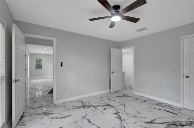 Discover this beautifully renovated 4-bedroom, 3-bath,  dream on Temple Terrace Golf and Country Club in Florida - for sale on GolfHomes.com, golf home, golf lot