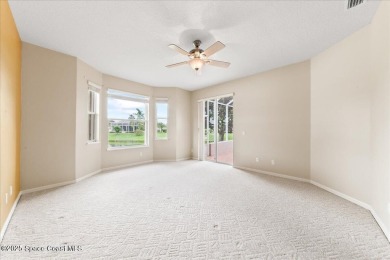 Live the good life in this upscale lakefront villa in Viera on Viera East Golf Club in Florida - for sale on GolfHomes.com, golf home, golf lot