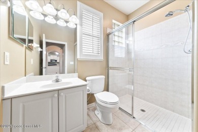 Live the good life in this upscale lakefront villa in Viera on Viera East Golf Club in Florida - for sale on GolfHomes.com, golf home, golf lot