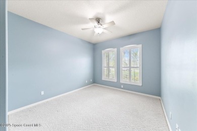 Live the good life in this upscale lakefront villa in Viera on Viera East Golf Club in Florida - for sale on GolfHomes.com, golf home, golf lot