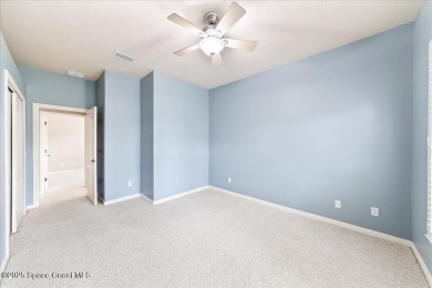 Live the good life in this upscale lakefront villa in Viera on Viera East Golf Club in Florida - for sale on GolfHomes.com, golf home, golf lot