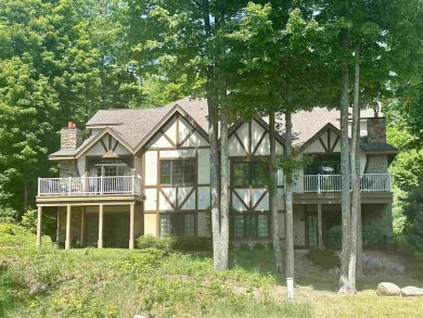 This highly sought after ski in/out condo offers spacious on Boyne Highlands Golf Courses in Michigan - for sale on GolfHomes.com, golf home, golf lot