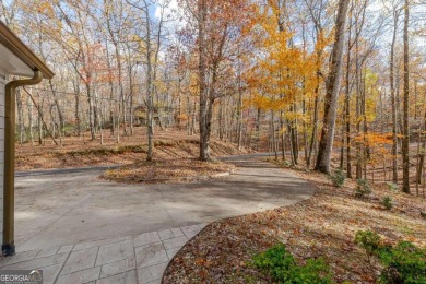 Nestled on a large, private, wooded lot in the serene Bent Tree on Bent Tree Golf Course in Georgia - for sale on GolfHomes.com, golf home, golf lot