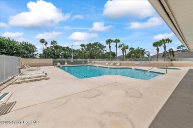Live the good life in this upscale lakefront villa in Viera on Viera East Golf Club in Florida - for sale on GolfHomes.com, golf home, golf lot