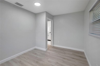 Discover this beautifully renovated 4-bedroom, 3-bath,  dream on Temple Terrace Golf and Country Club in Florida - for sale on GolfHomes.com, golf home, golf lot