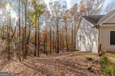 Nestled on a large, private, wooded lot in the serene Bent Tree on Bent Tree Golf Course in Georgia - for sale on GolfHomes.com, golf home, golf lot