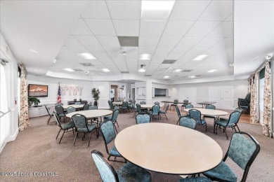 Live the good life in this upscale lakefront villa in Viera on Viera East Golf Club in Florida - for sale on GolfHomes.com, golf home, golf lot