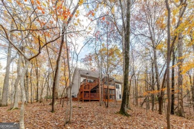 Nestled on a large, private, wooded lot in the serene Bent Tree on Bent Tree Golf Course in Georgia - for sale on GolfHomes.com, golf home, golf lot