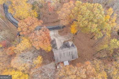 Nestled on a large, private, wooded lot in the serene Bent Tree on Bent Tree Golf Course in Georgia - for sale on GolfHomes.com, golf home, golf lot