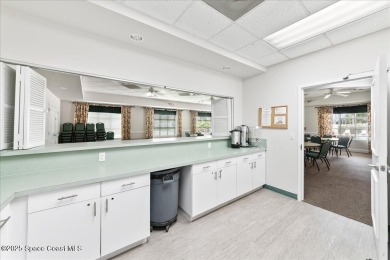Live the good life in this upscale lakefront villa in Viera on Viera East Golf Club in Florida - for sale on GolfHomes.com, golf home, golf lot