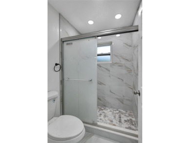 Discover this beautifully renovated 4-bedroom, 3-bath,  dream on Temple Terrace Golf and Country Club in Florida - for sale on GolfHomes.com, golf home, golf lot