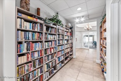 Live the good life in this upscale lakefront villa in Viera on Viera East Golf Club in Florida - for sale on GolfHomes.com, golf home, golf lot