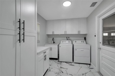 Discover this beautifully renovated 4-bedroom, 3-bath,  dream on Temple Terrace Golf and Country Club in Florida - for sale on GolfHomes.com, golf home, golf lot